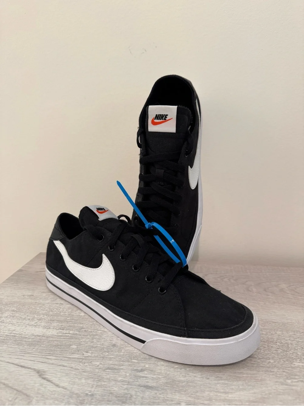 Nike Men’s Black & White Low-Top Sneakers with Orange Logo